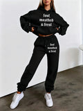 Autumn/Winter Trendy Fashion Women's Hooded Drawstring Sweatshirt and Sweatpants Set. Features a Hooded Drawstring Design and a Front Kangaroo Pocket on the Sweatshirt for Comfortable Cold-weather Wear. Classic Silhouette with a Comfortable Fit. - Black