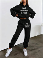 Autumn/Winter Trendy Fashion Women's Hooded Drawstring Sweatshirt and Sweatpants Set. Features a Hooded Drawstring Design and a Front Kangaroo Pocket on the Sweatshirt for Comfortable Cold-weather Wear. Classic Silhouette with a Comfortable Fit. - Black