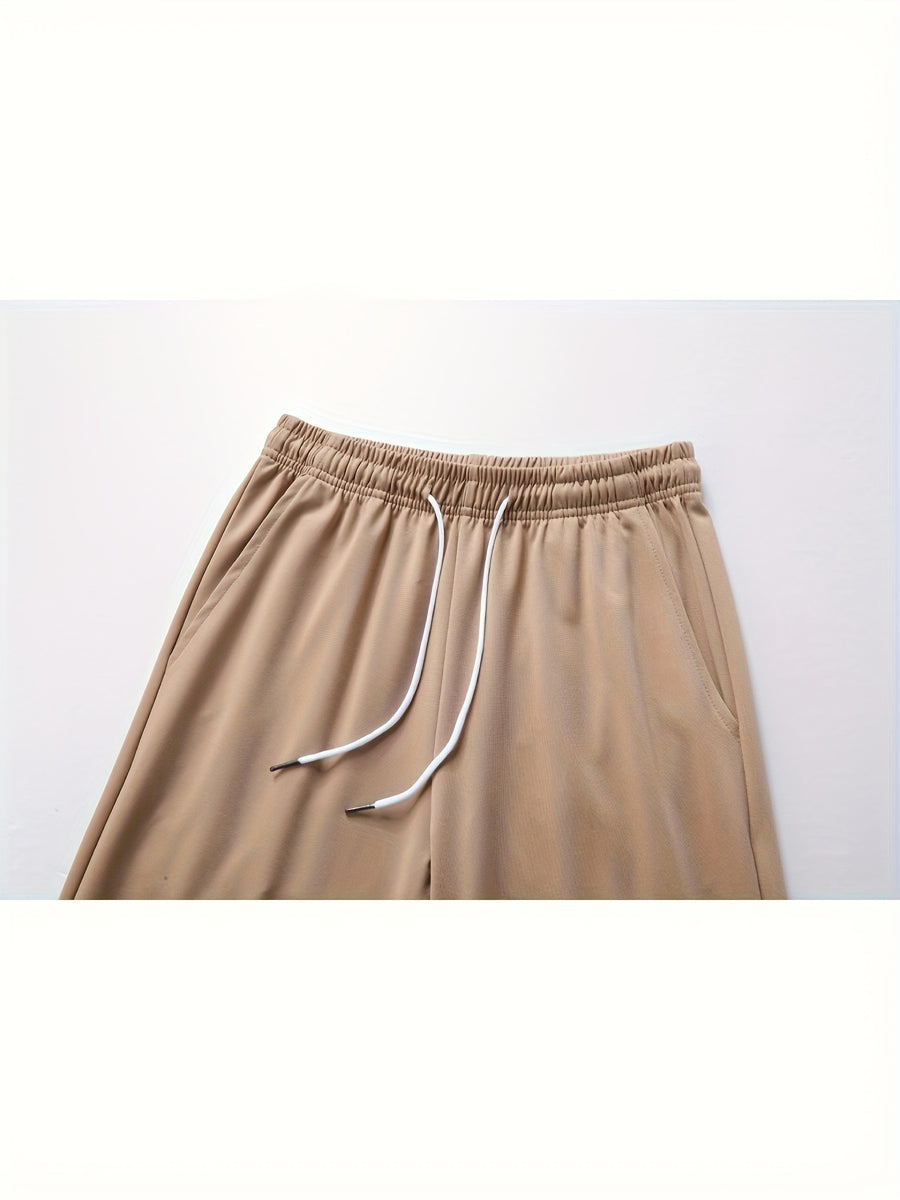 A Pair of Summer Women'S Long Pants, Casual Trousers for Women, Made of And, Featuring Elastic Fabric with Tapered Legs, an Elastic Drawstring at The Waist, Side Pockets, Suitable for Outdoor, Camping, Wear, And Women'S Pants. - Khaki