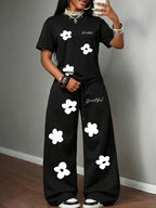 Spring/Summer New Set: 2pcs Outfit Featuring Hand-drawn Floral Print, Multi-color Round-neck Short-sleeve Top and Loose-fit Drawstring Straight-leg Pants. A Fashionable Y2K Streetwear Style with Hip-hop Y Vibes, Perfect for Summer Streetwear - Black