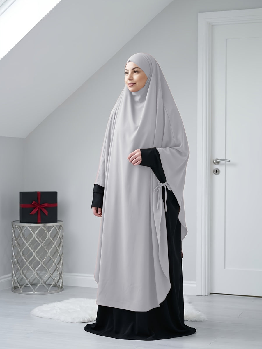 A Solid Color Nidaga Prayer Jilbab. The Fabric Is Skin-friendly and Breathable, Making It Suitable for Women to Wear and Pray Daily. The Robe Abaya Features a 1pc Design with a Khimar, Offering a Strong Drape and a Loose Fit, Ideal for Busy Daily - Light Grey