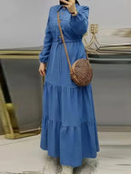 A Solid Color Long-Sleeve Dress for Women with a Fitted Waist, Tie Detail, And Ruffled Hem - Blue