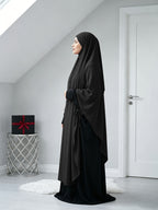 A Solid Color Nidaga Prayer Jilbab. The Fabric Is Skin-friendly and Breathable, Making It Suitable for Women to Wear and Pray Daily. The Robe Abaya Features a 1pc Design with a Khimar, Offering a Strong Drape and a Loose Fit, Ideal for Busy Daily - Black