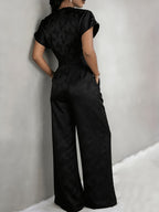 New Spring/Summer 2026 Women's Jacquard Short-Sleeve Jumpsuit with Subtle Butterfly Pattern, V-Neck, Cinched Waist, and Wide-Leg Pants. This Light Luxury, High-end Jumpsuit Offers a Sophisticated Look for Commuting. The Simple and Exquisite V-neck - Black