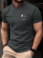 100% Cotton Men's T-Shirt, Summer Short Sleeve Thin Top, Trendy Fashion Slim Fit Youth Daily Casual Versatile 2026 New Year Holiday Outfit, Simple Line Joyful Face Pattern with Playful Winking Expression Design for Added Fun - Dark Gray