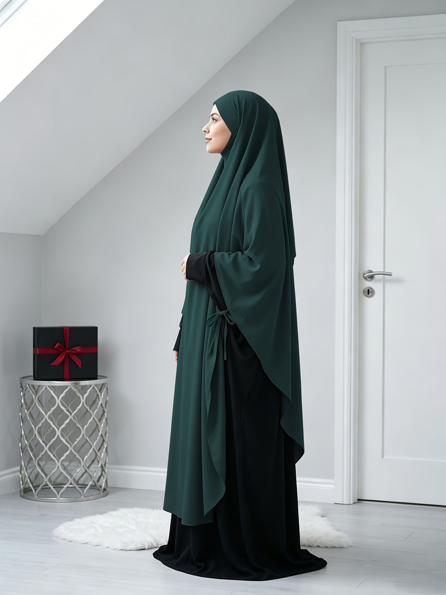 A Solid Color Nidaga Prayer Jilbab. The Fabric Is Skin-friendly and Breathable, Making It Suitable for Women to Wear and Pray Daily. The Robe Abaya Features a 1pc Design with a Khimar, Offering a Strong Drape and a Loose Fit, Ideal for Busy Daily - Dark Green