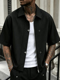 Metal Snap-button Lapel Short-sleeve Casual Shirt. Stylish Design, Smooth and Skin-friendly, Short-sleeve Cut, Lightweight and Breathable, Suitable for Summer Outings. Loose Short-cropped Fit, Dark Streetwear Trend Attire - Black