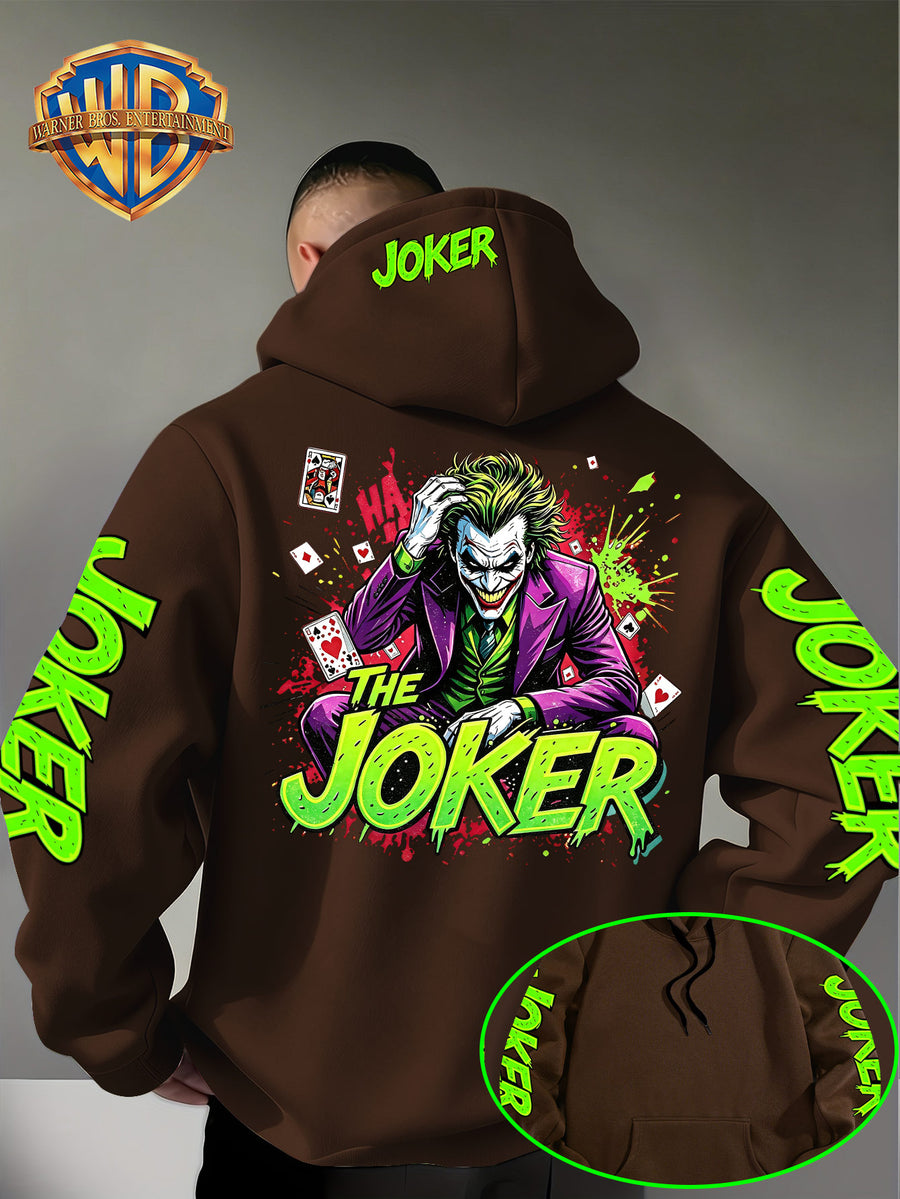 Official Warner Bros. Joker Comic-style Print Featuring Red and Green Ink-splatter Effects and "THE JOKER" Lettering. The Sleeves and Back of the Hood Are Adorned with Green "JOKER" Lettering. This Men's Trendy Printed Hooded Sweatshirt Features - Coffee Color