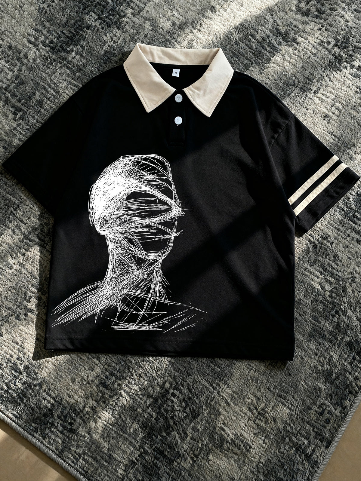 Men's New Polo Shirt, Black Base with Beige Contrast Collar, Double White Stripes on Cuffs, Abstract Line Portrait Print on Chest, Loose Fit, Artistic and Atmospheric, Suitable for Daily Casual and Commute. - Black