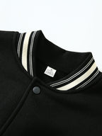 This Black And Gray Patchwork Baseball Jacket Features a Button Closure Design, with Black And White Striped Accents at The Collar And Cuffs. It Showcases Prominent Letter Prints And English Text Elements on The Chest - Black And Grey