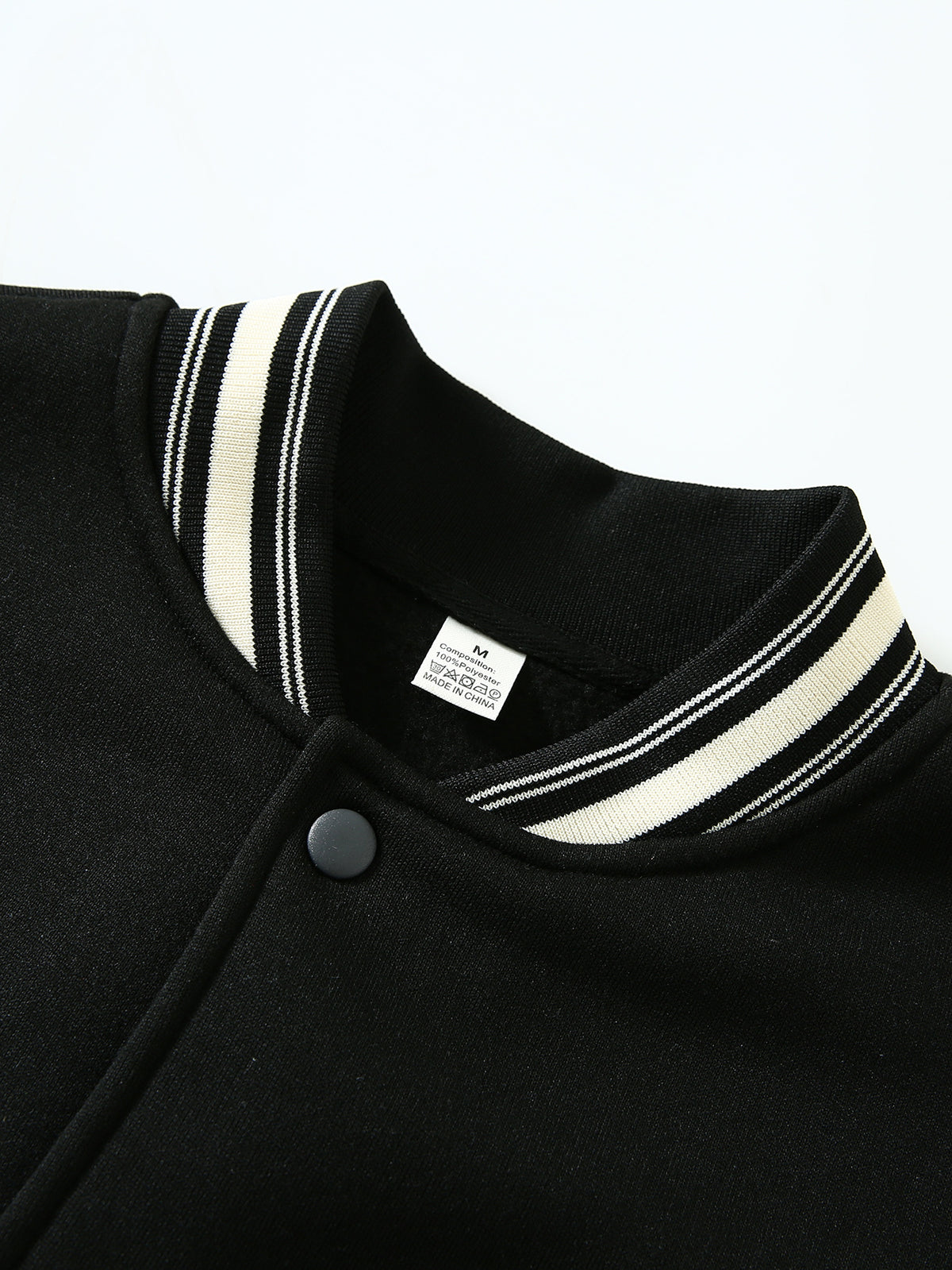 This Black And Gray Patchwork Baseball Jacket Features a Button Closure Design, with Black And White Striped Accents at The Collar And Cuffs. It Showcases Prominent Letter Prints And English Text Elements on The Chest - Black And Grey