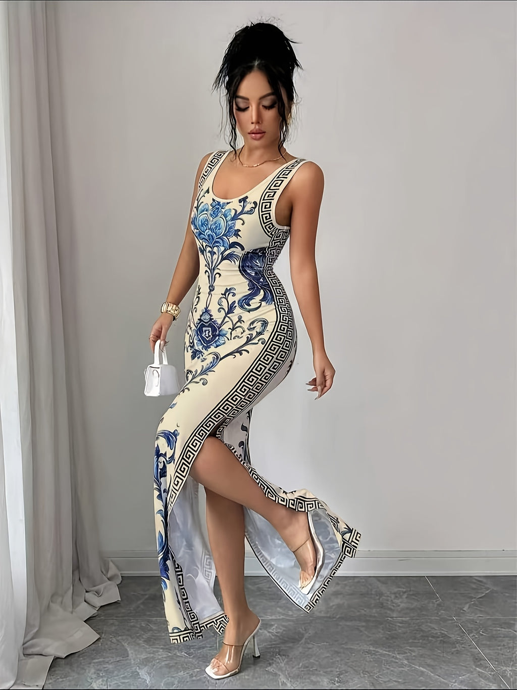Elegant And Refined Sleeveless Round-Neck Slim-Fit Long Floral Print Dress with Side Slit. A Sophisticated Fashion Piece Perfect As a Bridesmaid Gown for Evening Galas, Parties, Vacations, And Beachside Wear - Blue