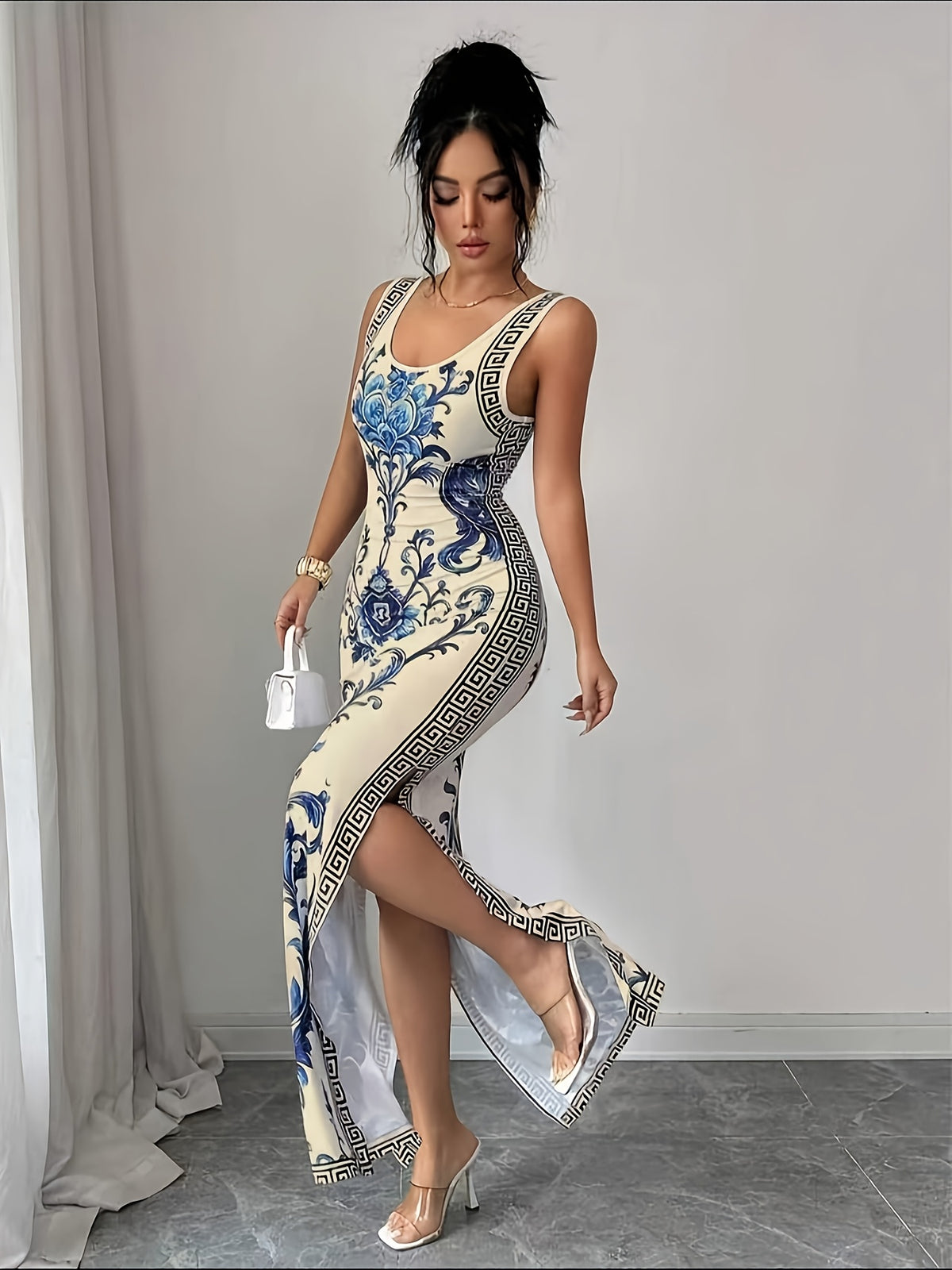 Elegant And Refined Sleeveless Round-Neck Slim-Fit Long Floral Print Dress with Side Slit. A Sophisticated Fashion Piece Perfect As a Bridesmaid Gown for Evening Galas, Parties, Vacations, And Beachside Wear - Blue