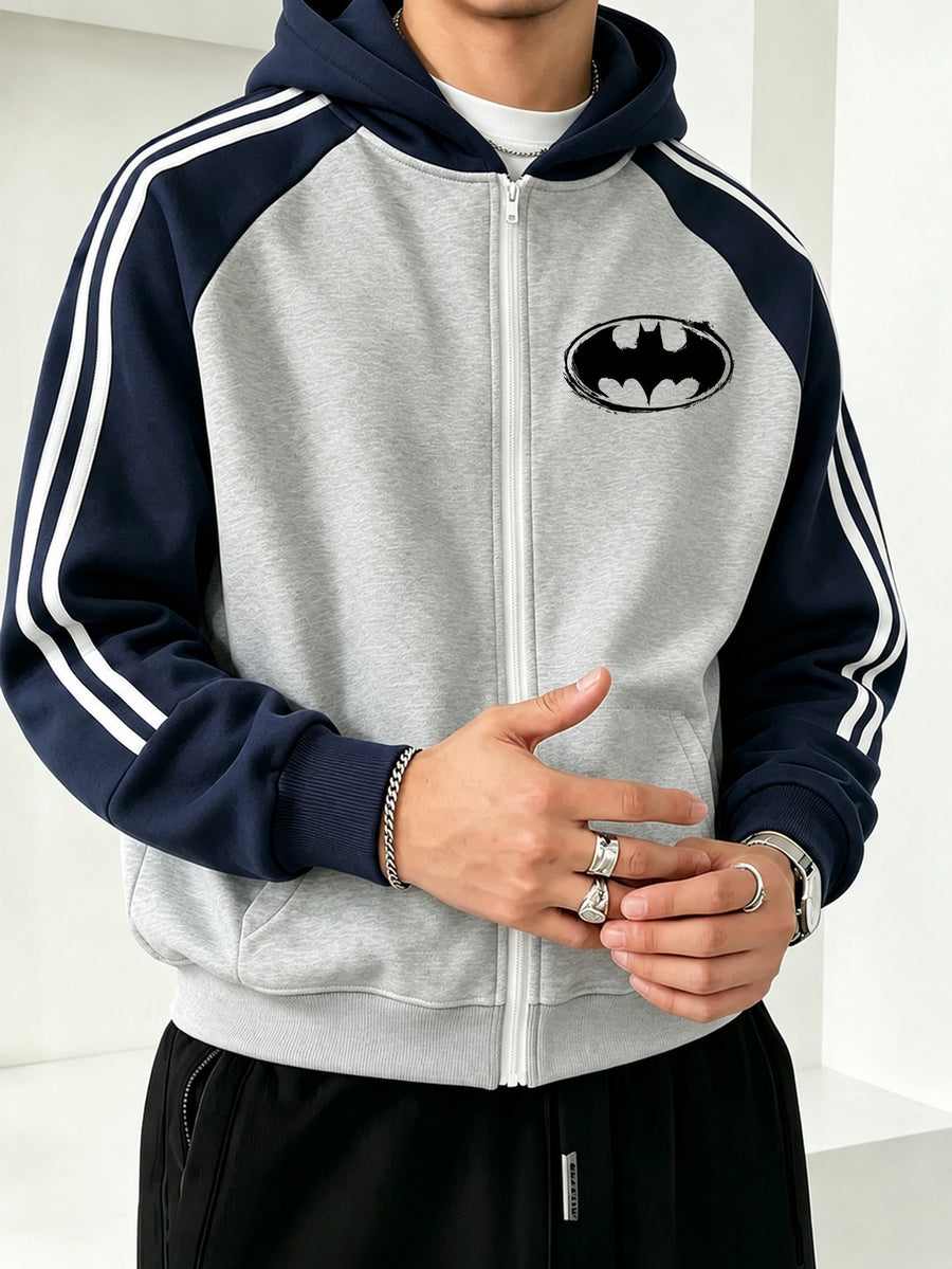 Officially Licensed by Warner Bros., This New Men's Colour-blocked Fashion Hoodie Features a Batman Logo Print with a Brushstroke Border. A Zipped Hooded Jacket for Autumn and Winter, It Has a Relaxed Fit and Is Made from Comfortable Fabric. - Grey-blue